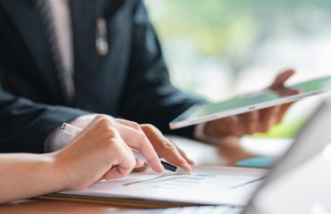 Business partners getting together thinking about their business statement